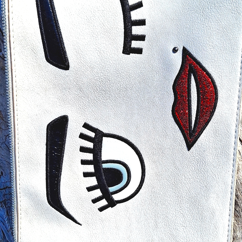 Carlos Santana White clutch purse.